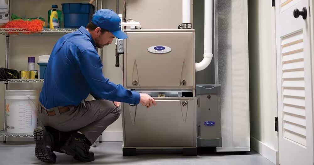 HVAC technician Opening up Furnace Door